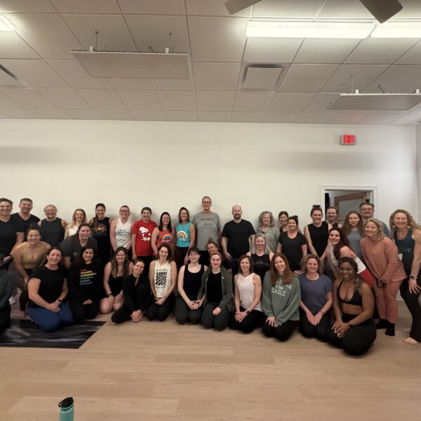 Photo of participants at iShine Yoga & Wellness in Huntersville during a fundraiser for Carolina Migrant Network - “Rooted in Solidarity: Breath, Movement and Community Care. Photo by Penelope Goldstein, Queens University News Service