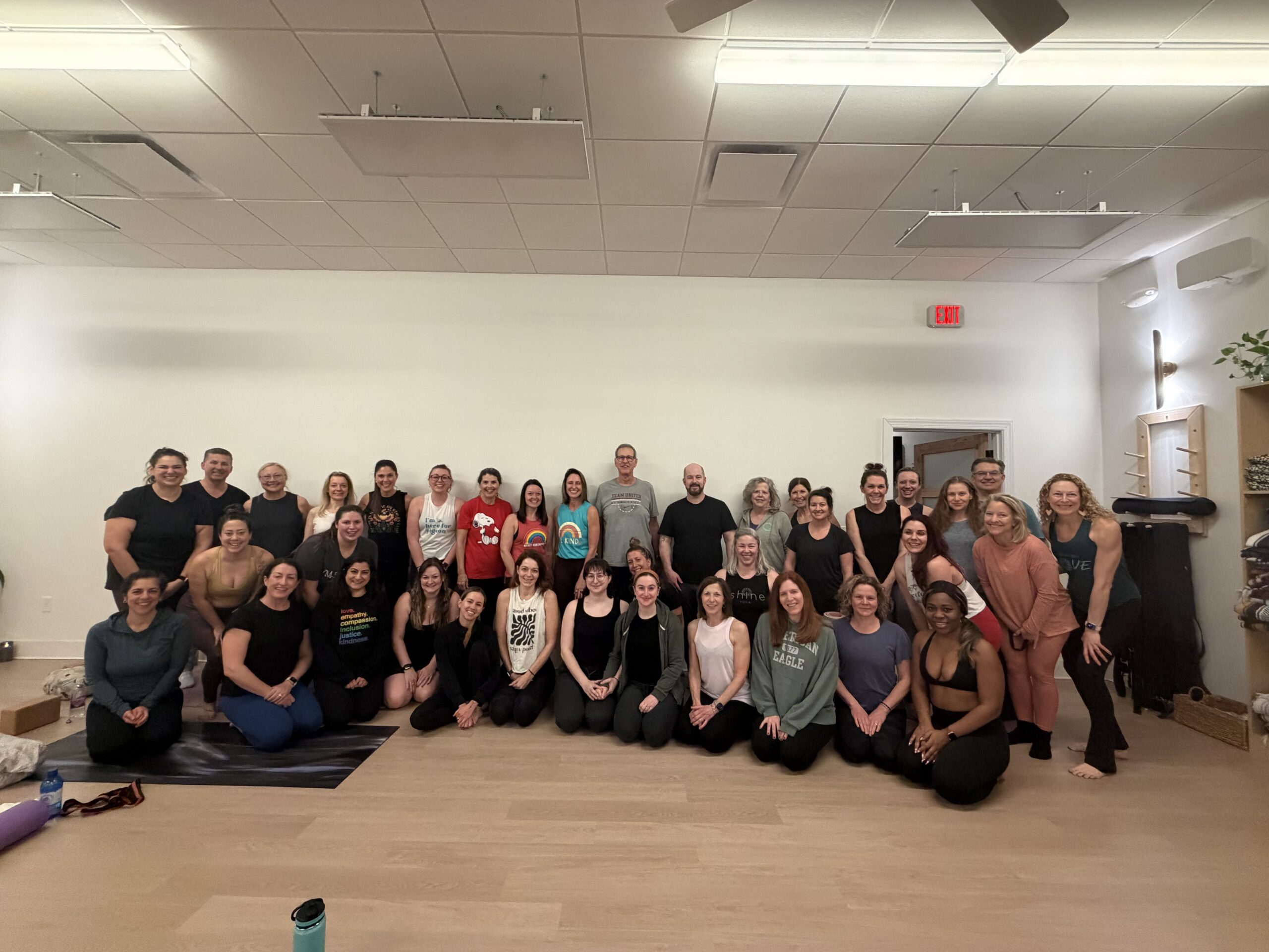 Photo of participants at iShine Yoga & Wellness in Huntersville during a fundraiser for Carolina Migrant Network - “Rooted in Solidarity: Breath, Movement and Community Care. Photo by Penelope Goldstein, Queens University News Service