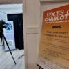 A poster and video camera at the entrance to the Voces de Charlotte event on Oct. 1.